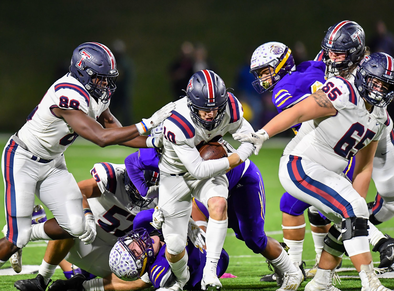 Houston Tx. Nov 19, 2021:  Tompkins #10 Wyatt Young rushes for a first down during the UIL area playoff game between Tompkins and Jersey Village at Pridgeon Stadium in Houston. (Photo by Mark Goodman / Katy Times)