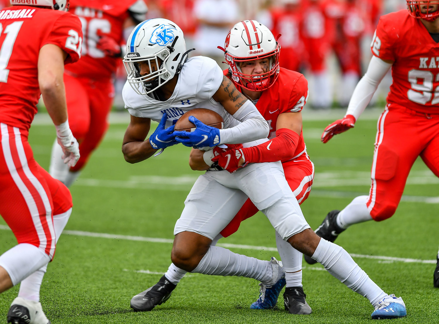 Katy Tx. Nov 26, 2021: Katy's #24 Hamilton McMartin makes the stop on King Panthers Malachi Boles #2 during the UIL regional playoff game between Katy Tigers and King Panthers at Legacy Stadium in Katy. (Photo by Mark Goodman / Katy Times)