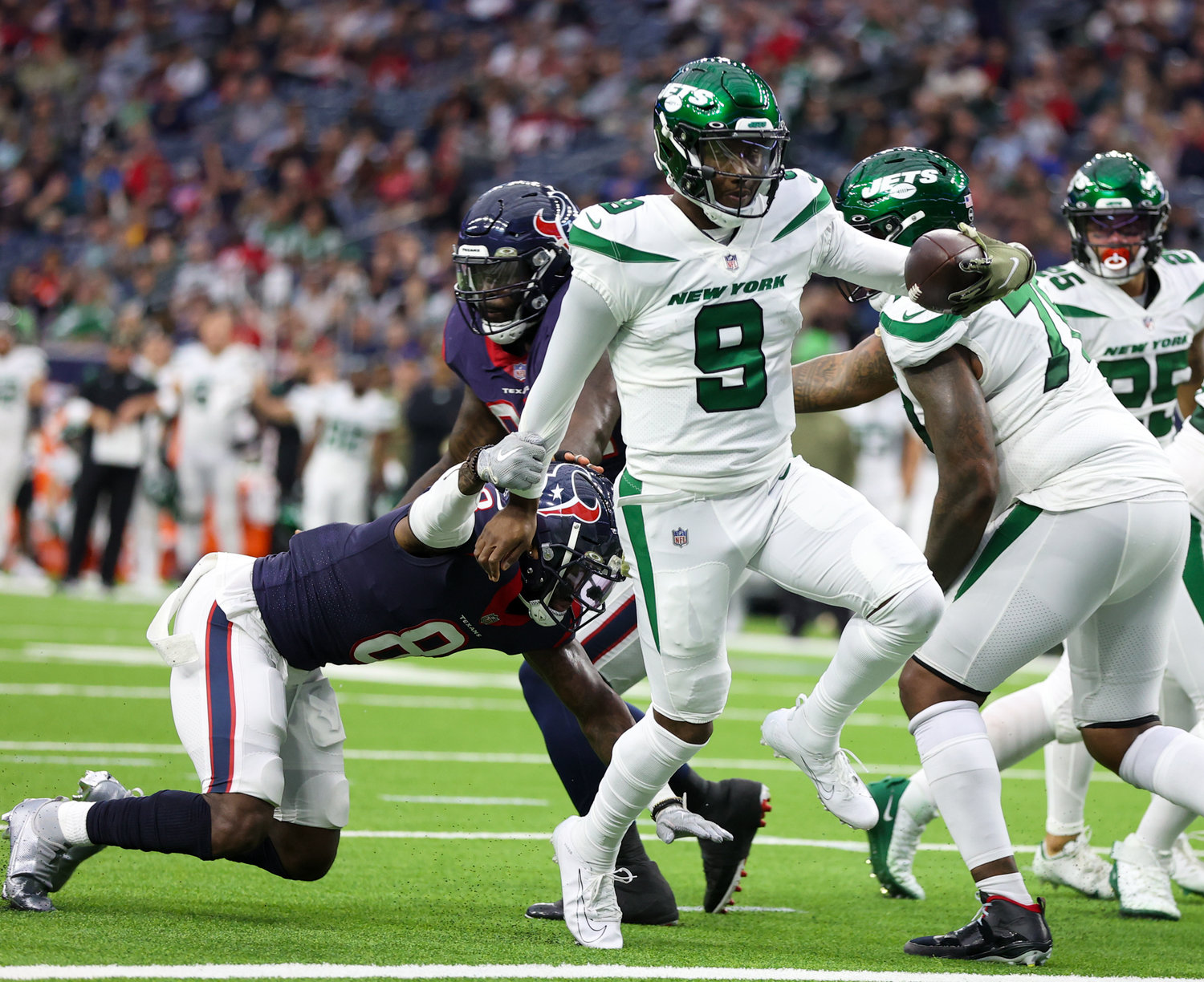 New York Jets quarterback Josh Johnson (9) carries the ball into the end zone for a 2-point conversion during an NFL game between the Houston Texans and the New York Jets on November 28, 2021 in Houston, Texas.