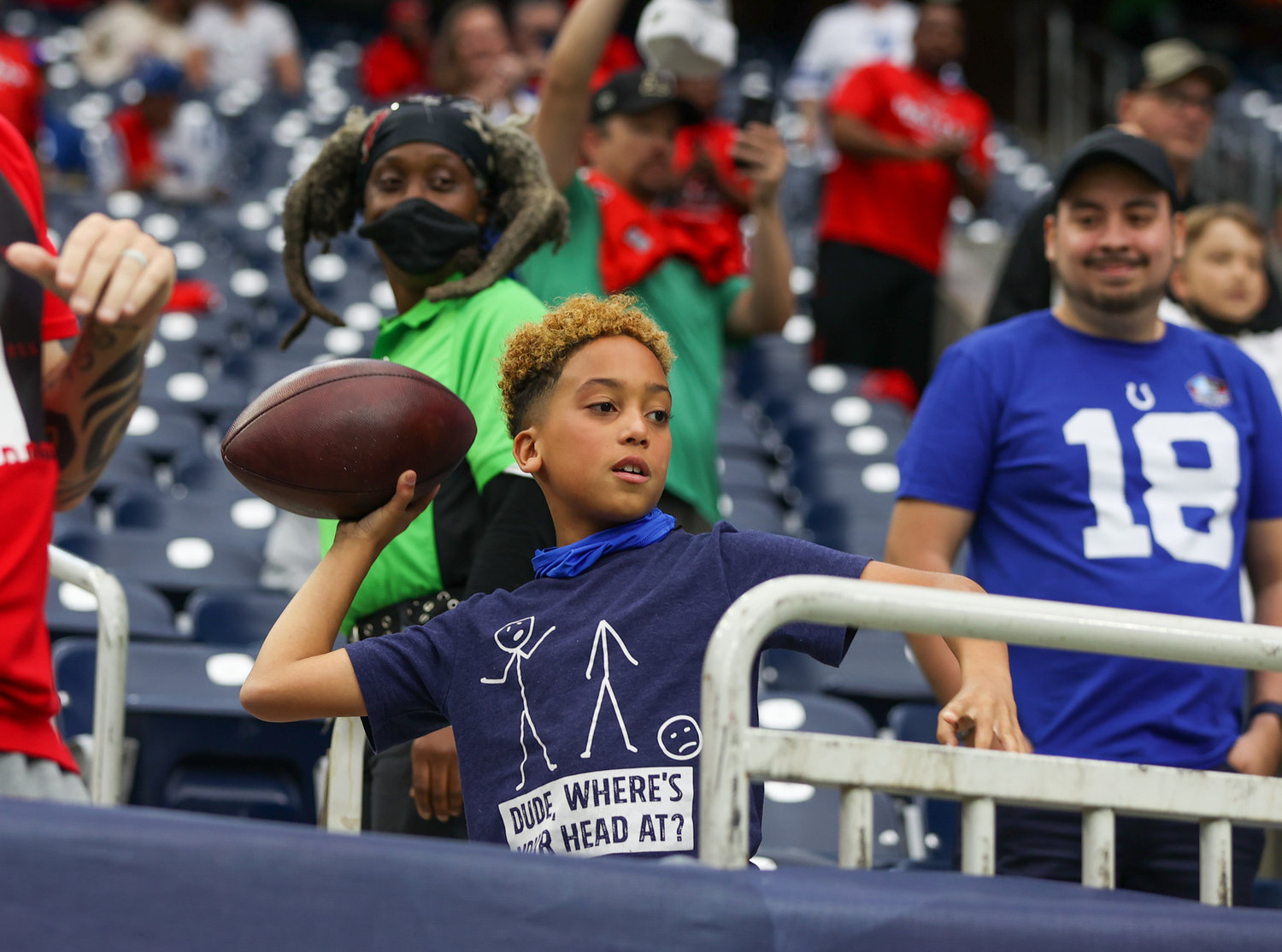 A fan plays catch with Indianapolis Colts wide receiver Zach Pascal (14) before the start of an NFL game between the Texans and the Colts on December 5, 2021 in Houston, Texas.