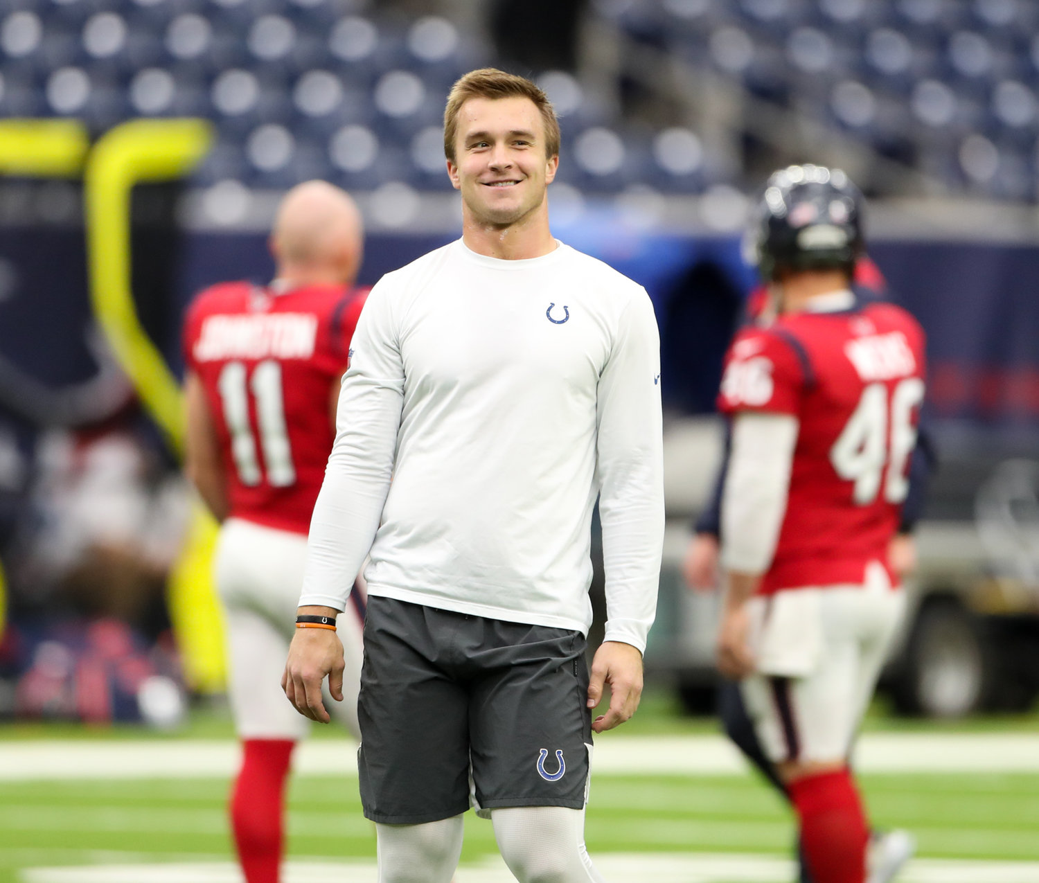 Indianapolis Colts and former Texas Longhorn and Westlake Chaparral quarterback Sam Ehlinger (4) warms up before an NFL game between the Texans and the Colts on December 5, 2021 in Houston, Texas.