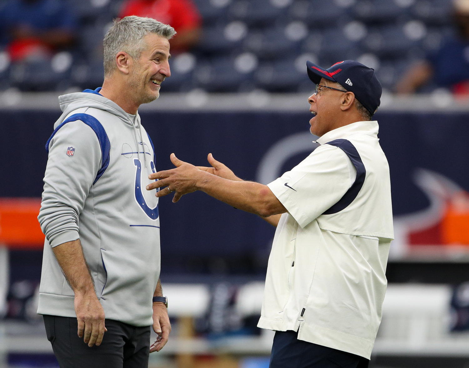 Indianapolis Colts head coach Frank Reich (left) talks with Houston Texans head coach David Culley before the start of an NFL game between the Texans and the Colts on December 5, 2021 in Houston, Texas.