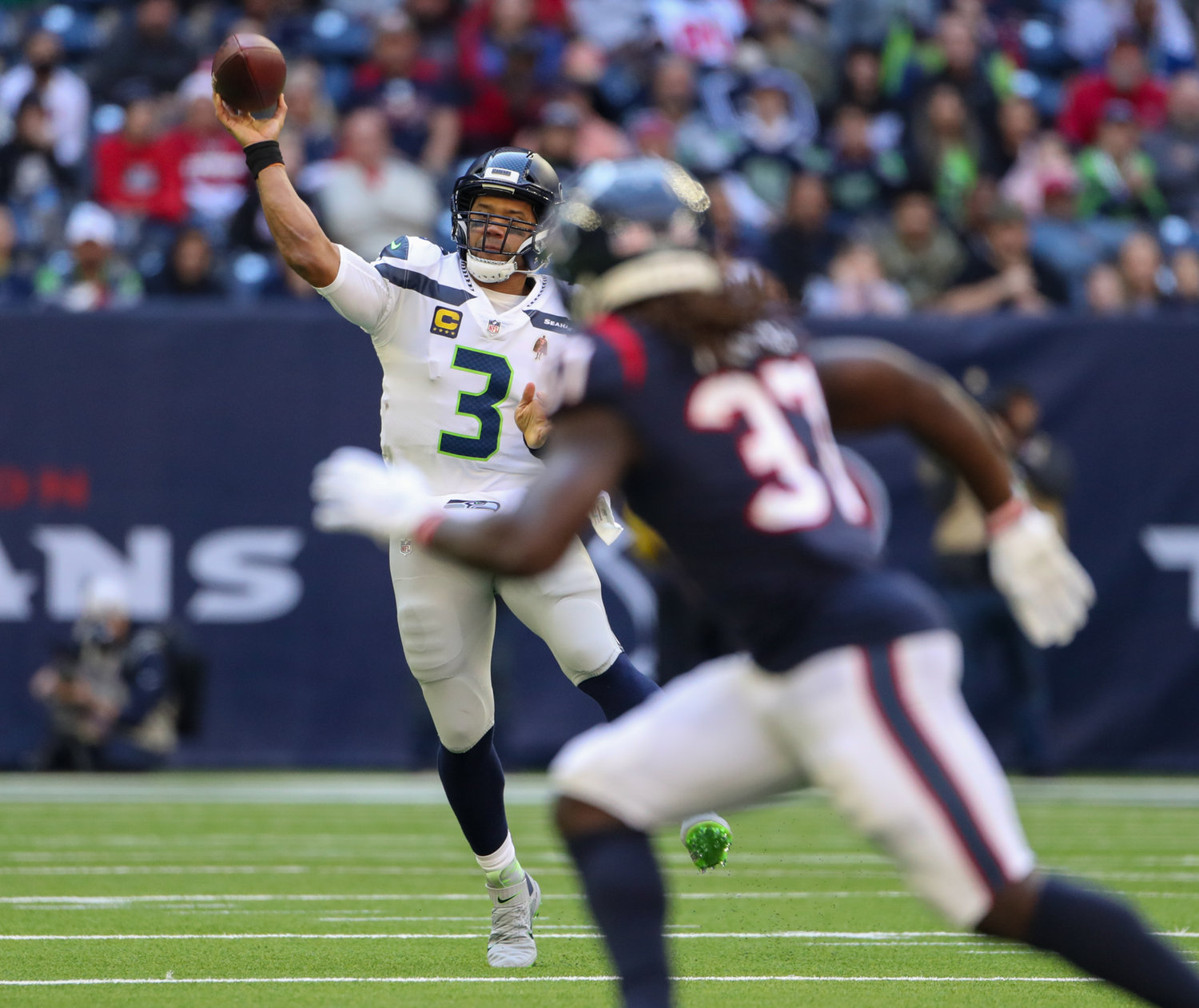 Seattle Seahawks quarterback Russell Wilson (3) passes the ball during the first half of an NFL game between the Seahawks and the Texans on December 12, 2021 in Houston, Texas.