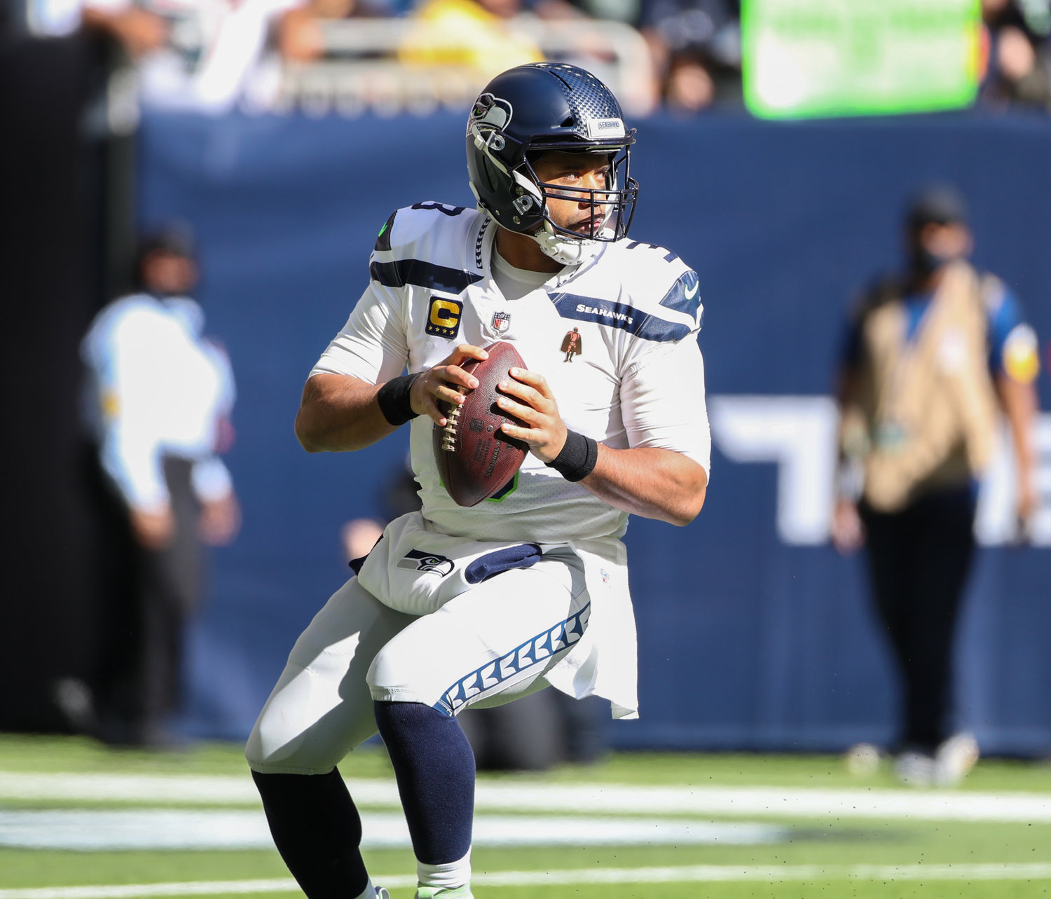 Seattle Seahawks quarterback Russell Wilson (3) drops back to pass during the first half of an NFL game between the Seahawks and the Texans on December 12, 2021 in Houston, Texas.