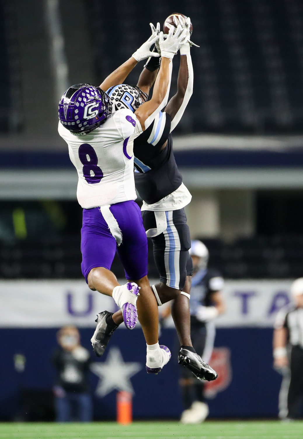 College Station Cougars defensive back Anthony Tisdell (8) knocks down a pass intended for Paetow Panthers wide receiver Kole Wilson (11) during the Class 5A Division I state football championship game between Paetow and College Station on December 17, 2021 in Arlington, Texas.