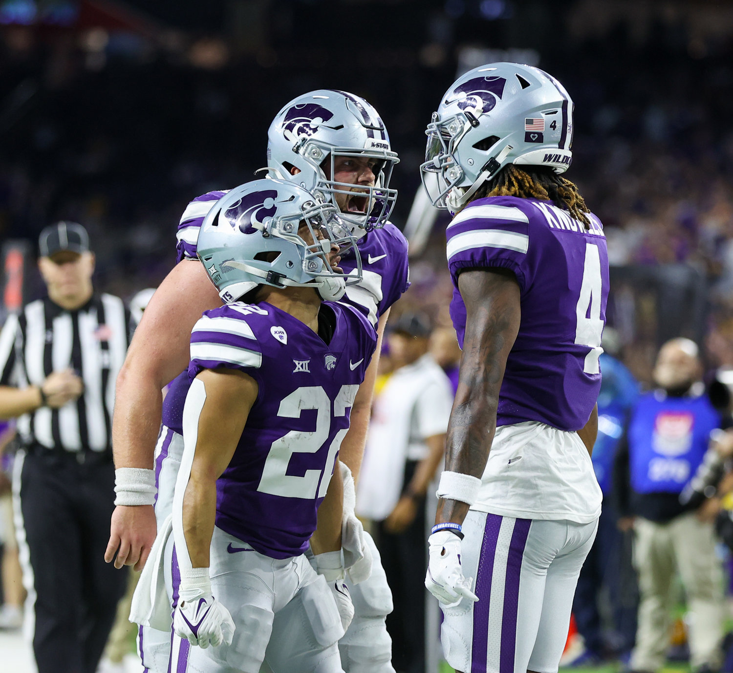 Teammates congratulate Kansas State Wildcats wide receiver Malik Knowles (4) after a touchdown reception during the TaxAct Texas Bowl on Jan. 4, 2022 in Houston, Texas.