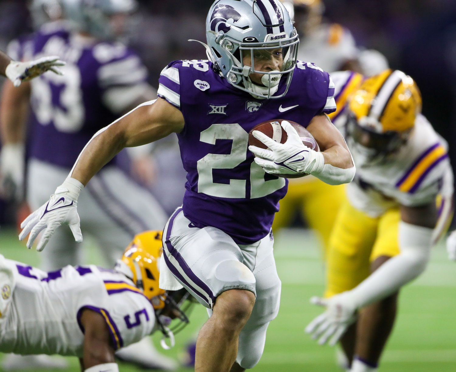 Kansas State Wildcats running back Deuce Vaughn (22) carries the ball for a touchdown during the TaxAct Texas Bowl on Jan. 4, 2022 in Houston, Texas.