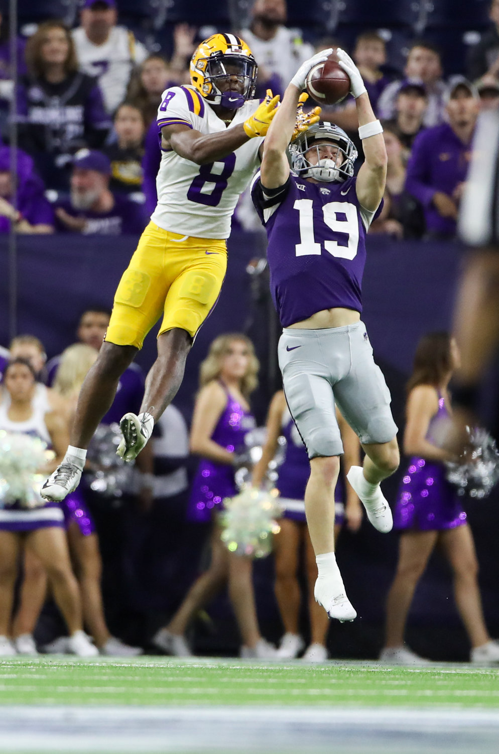 Kansas State Wildcats defensive back Ross Elder (19) intercepts a pass intended for LSU Tigers wide receiver Malik Nabers (8) during the TaxAct Texas Bowl on Jan. 4, 2022 in Houston, Texas.