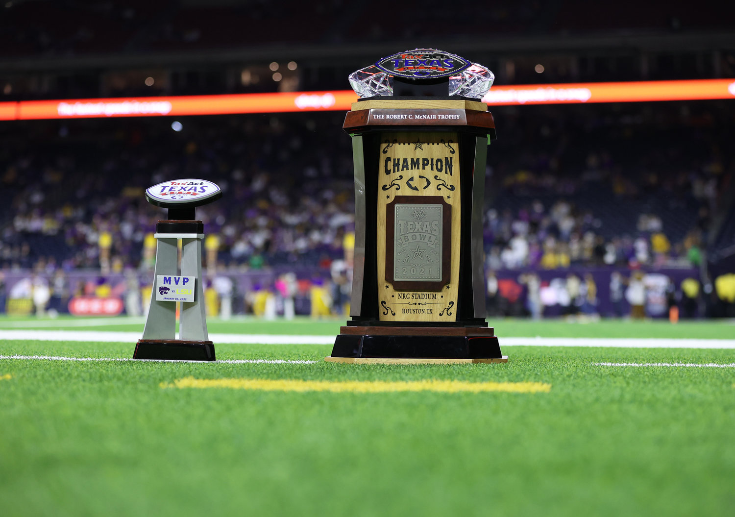 The MVP and championship trophies for the TaxAct Texas Bowl on the sideline in the fourth quarter of Kansas State’s 42-20 win over LSU on Jan. 4, 2022 in Houston, Texas.