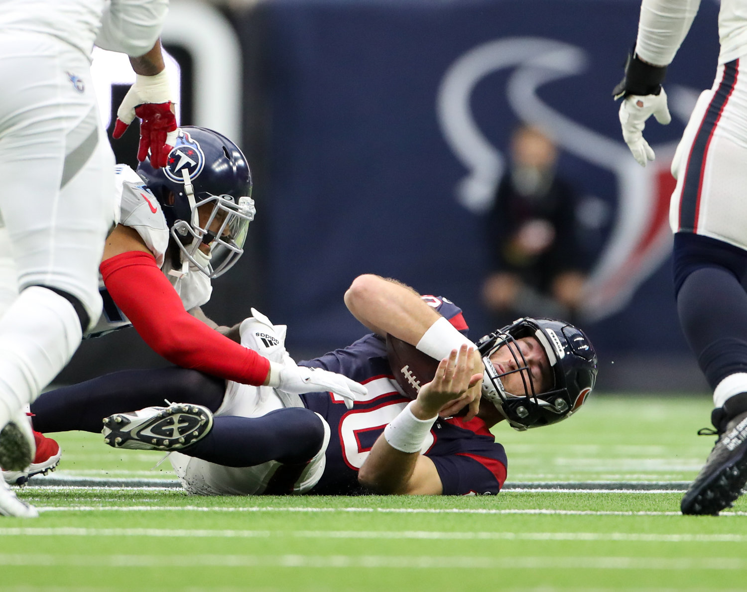 Houston Texans quarterback Davis Mills (10) is sacked during an NFL game between the Texans and the Titans on Jan. 9, 2022 in Houston, Texas.