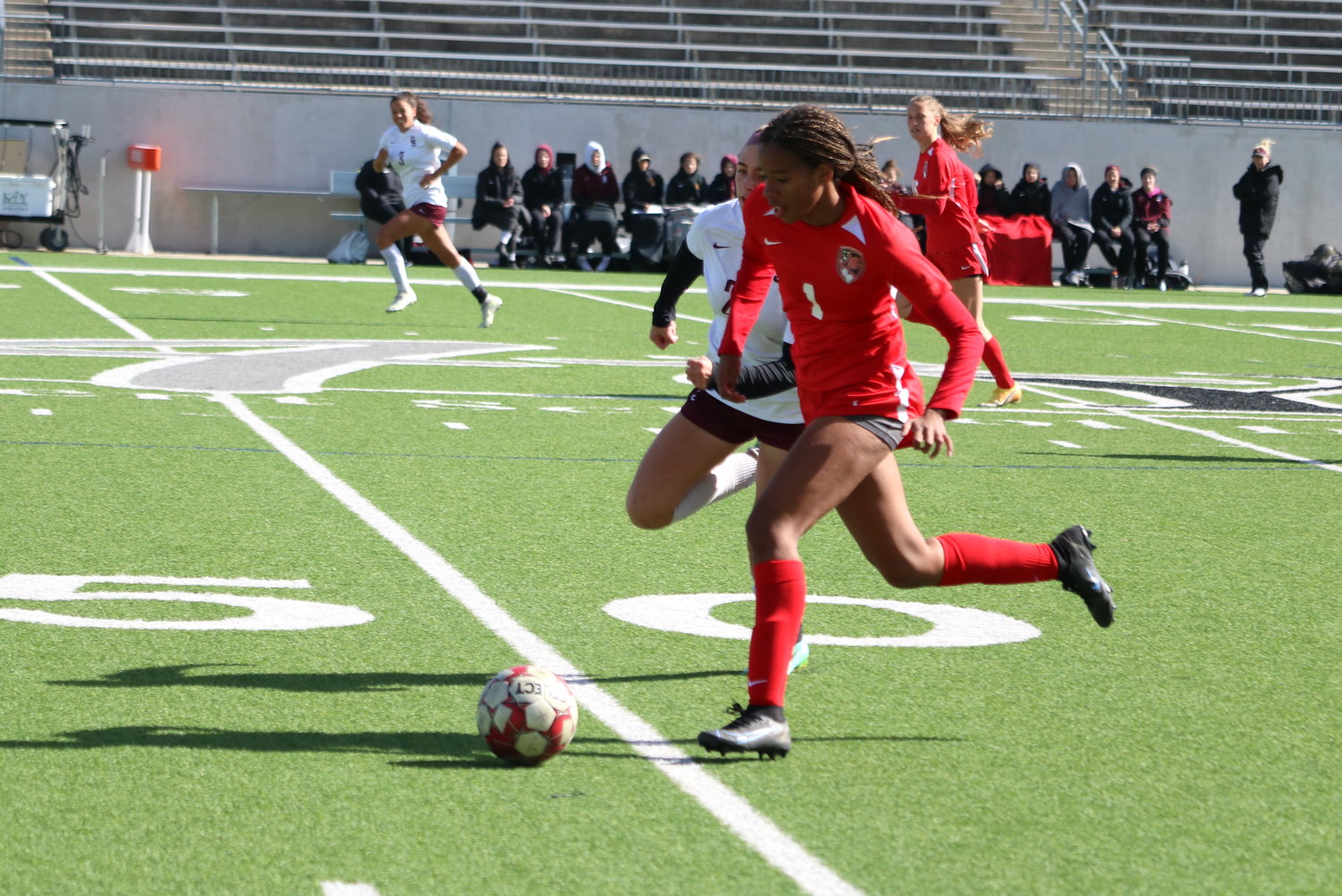 Olyvia Witham dribbles the ball during a game between Katy and Dripping Springs at Legacy Stadium on Saturday.