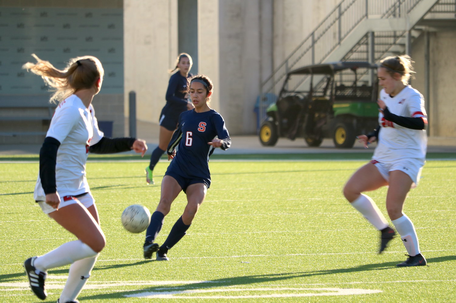 Emma Veliz makes a pass during Saturday’s game between Seven Lakes and Lake Travis at Legacy Stadium.