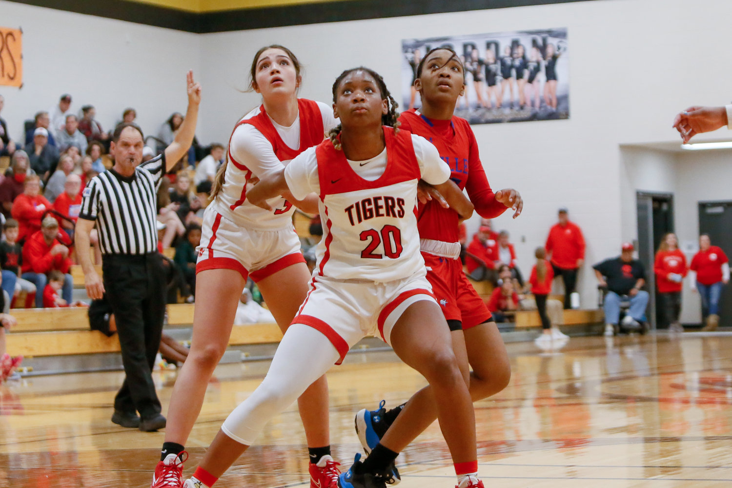 Katy's Brianna Nelson boxes out a Fort Bend Dulles defender during Monday's game.