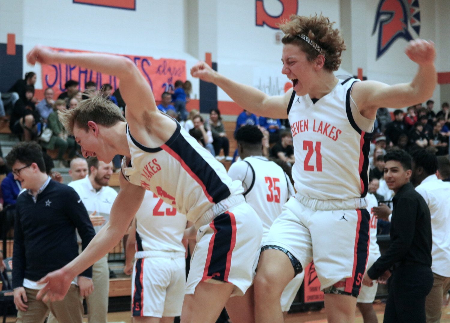 Noah Simiskey and Luke Simank celebrate after Seven Lakes clinched an outright district title with a win over Taylor on Wednesday at the Seven Lakes gym.