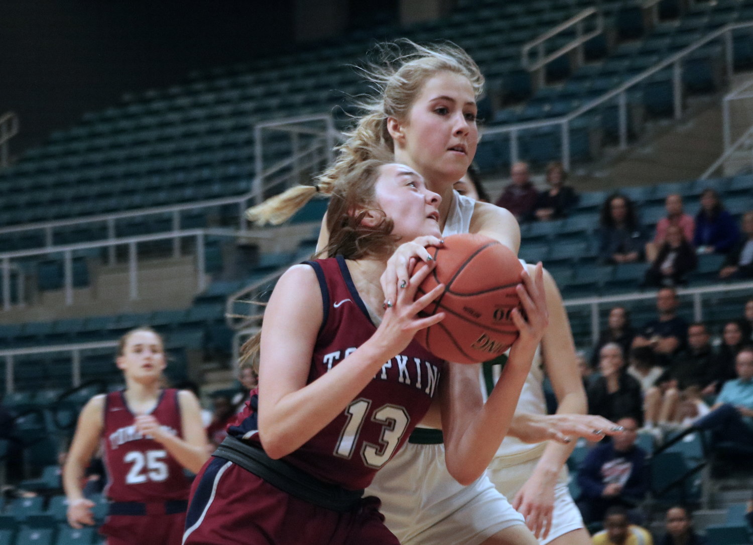 Macy Spencer fights through contact during Friday’s game between Tompkins and Stratford at the Merrell Center.