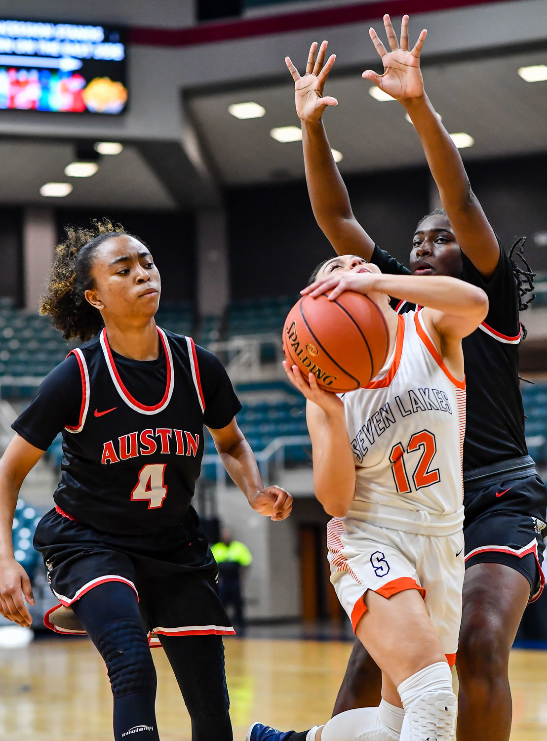 Katy Tx. Feb 22, 2022:  Seven Lakes Cailyn Tucker #12 drives to the basket during the Regional Quarterfinal playoff game, Seven Lakes vs Fort Bend Austin at the Merrell Center. (Photo by Mark Goodman / Katy Times)