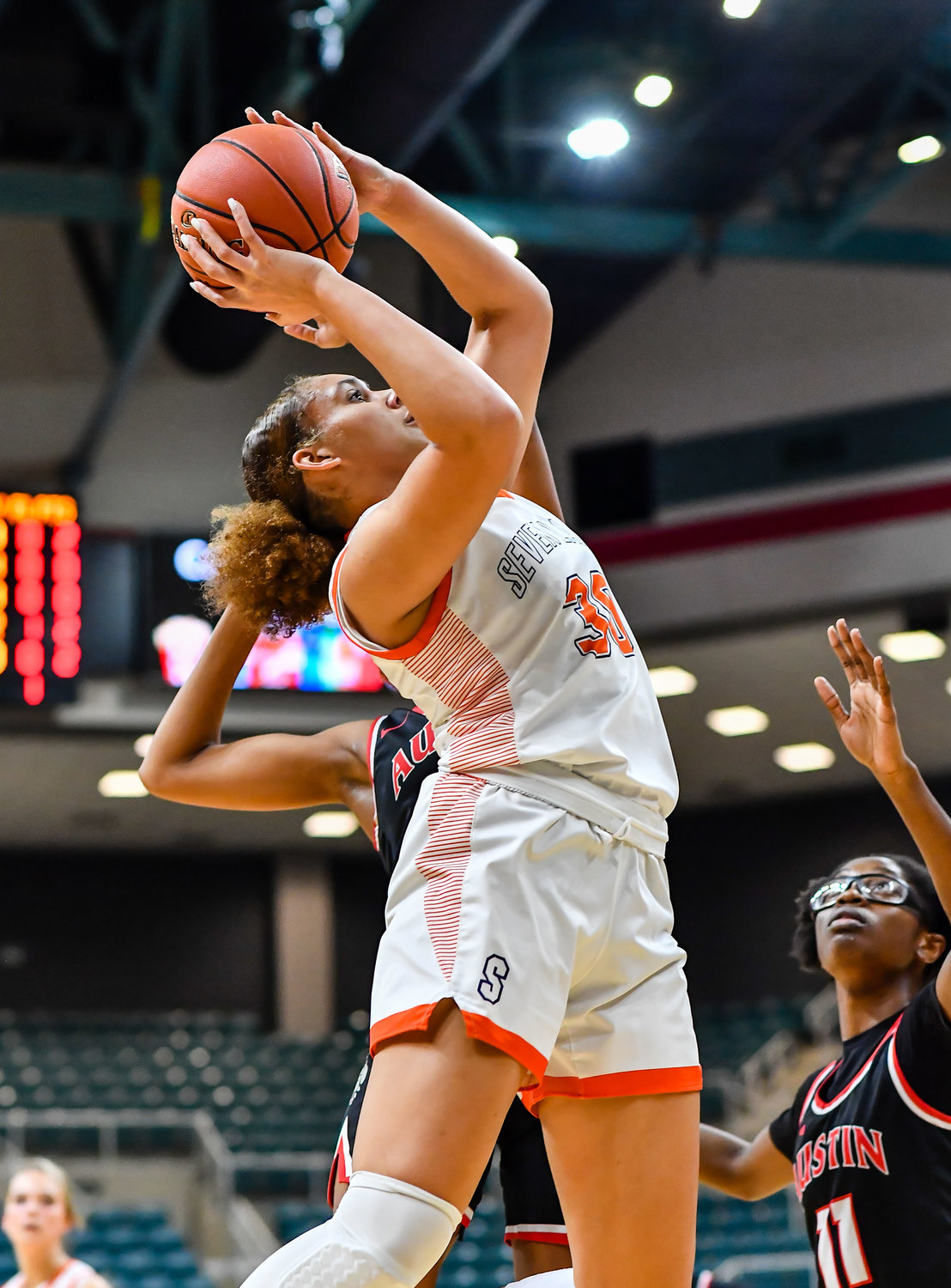Katy Tx. Feb 22, 2022:  Seven Lakes Justice Carlton #30 leeds the Spartans to a win during the Regional Quarterfinal playoff game, Seven Lakes vs Fort Bend Austin at the Merrell Center. (Photo by Mark Goodman / Katy Times)