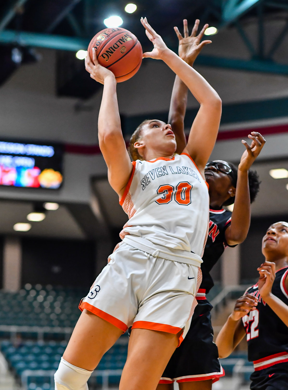 Katy Tx. Feb 22, 2022:  Seven Lakes Justice Carlton #30 drives to the basket scoring during the Regional Quarterfinal playoff game, Seven Lakes vs Fort Bend Austin at the Merrell Center. (Photo by Mark Goodman / Katy Times)