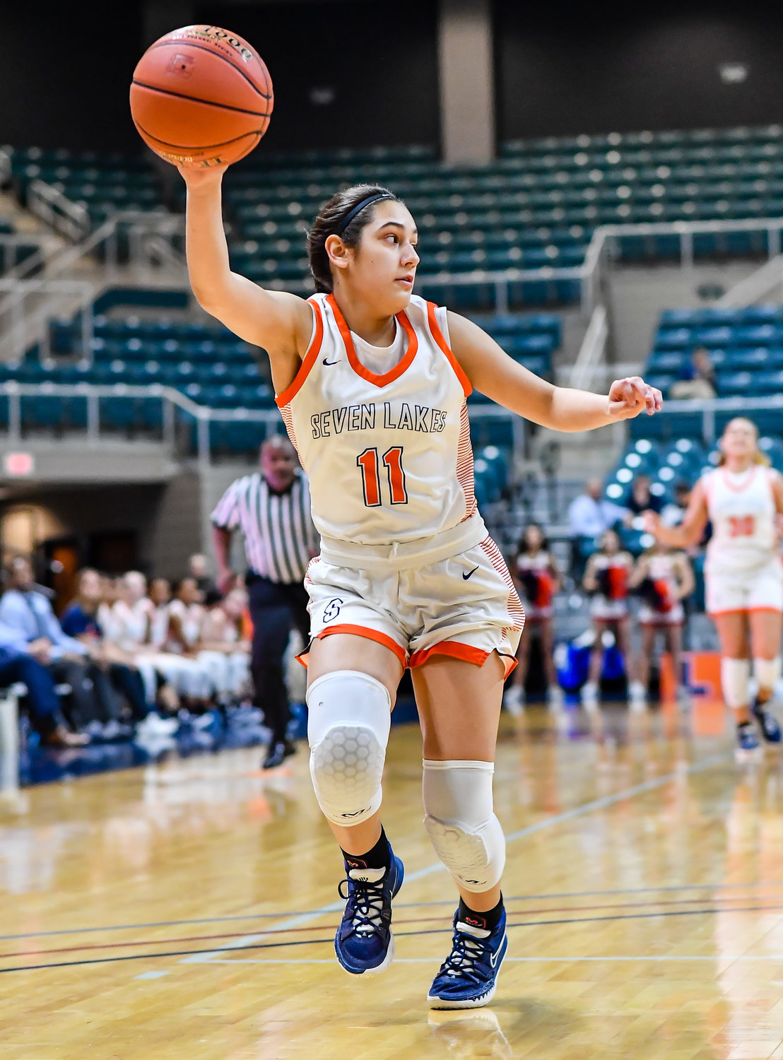 Katy Tx. Feb 22, 2022:  Seven Lakes Caitlyn Quintero #11 looks to pass the ball off during the Regional Quarterfinal playoff game, Seven Lakes vs Fort Bend Austin at the Merrell Center. (Photo by Mark Goodman / Katy Times)