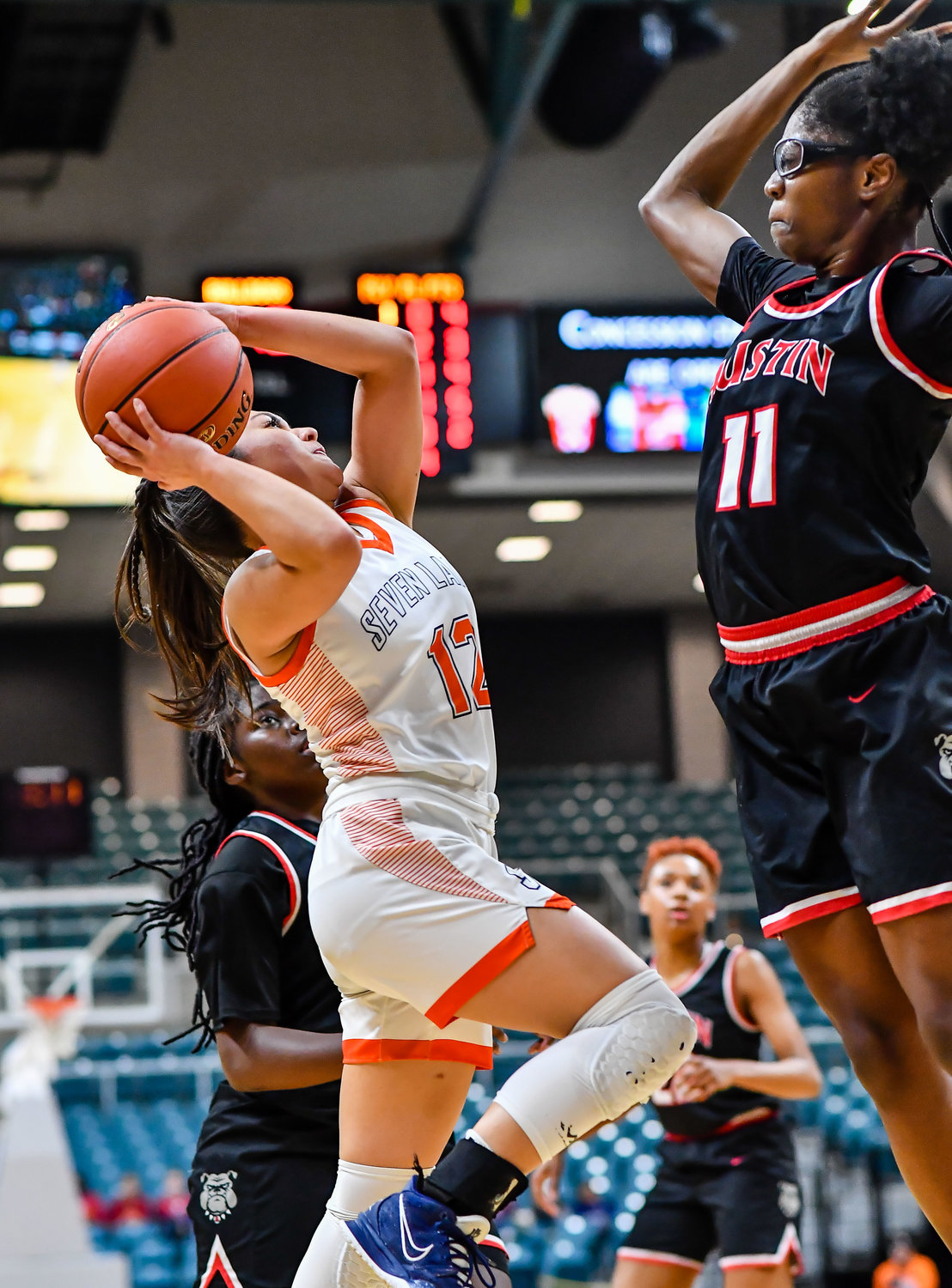 Katy Tx. Feb 22, 2022:  Seven Lakes Cailyn Tucker #12 goes up for the shot during the Regional Quarterfinal playoff game, Seven Lakes vs Fort Bend Austin at the Merrell Center. (Photo by Mark Goodman / Katy Times)