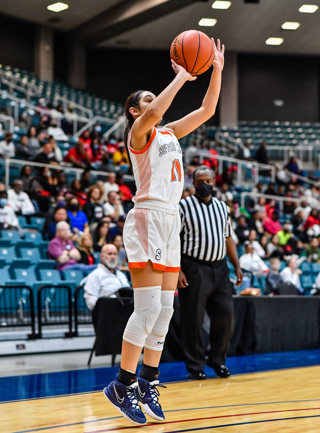 Katy Tx. Feb 22, 2022:  Seven Lakes Caitlyn Quintero #11 goes up for the shot during the Regional Quarterfinal playoff game, Seven Lakes vs Fort Bend Austin at the Merrell Center. (Photo by Mark Goodman / Katy Times)