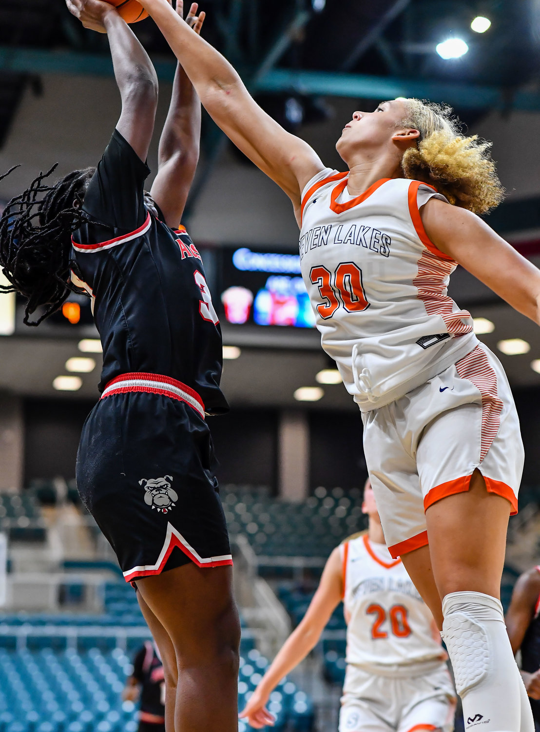 Katy Tx. Feb 22, 2022:  Seven Lakes Justice Carlton #30 gets the block on a shot by Fort Bend Austins India Jackson #30 during the Regional Quarterfinal playoff game, Seven Lakes vs Fort Bend Austin at the Merrell Center. (Photo by Mark Goodman / Katy Times)