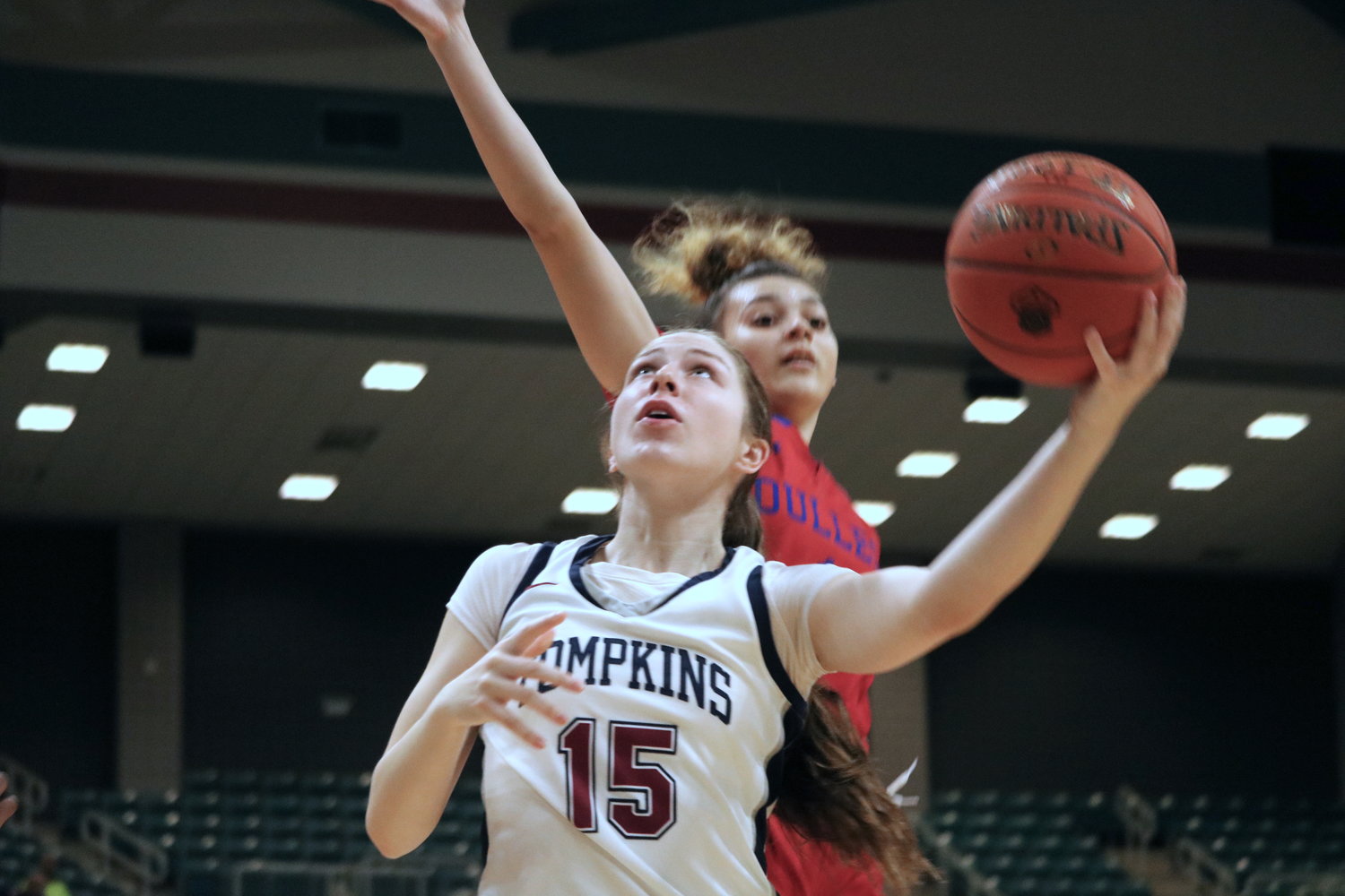 Tompkins’ Emma Potts shoots a layup during Tuesday’s Class 6A regional quarterfinal against Fort Bend Dulles at the Merrell Center.