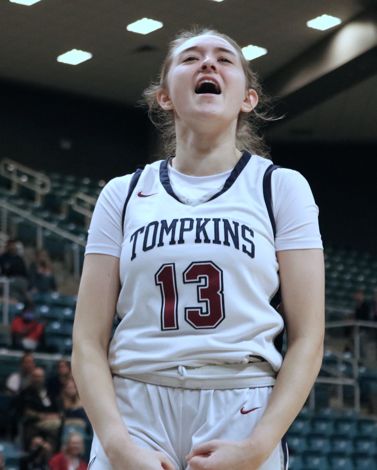 Tompkins’ Macy Spencer celebrates after scoring an and-1 during Tuesday’s Class 6A regional quarterfinal against Fort Bend Dulles at the Merrell Center.