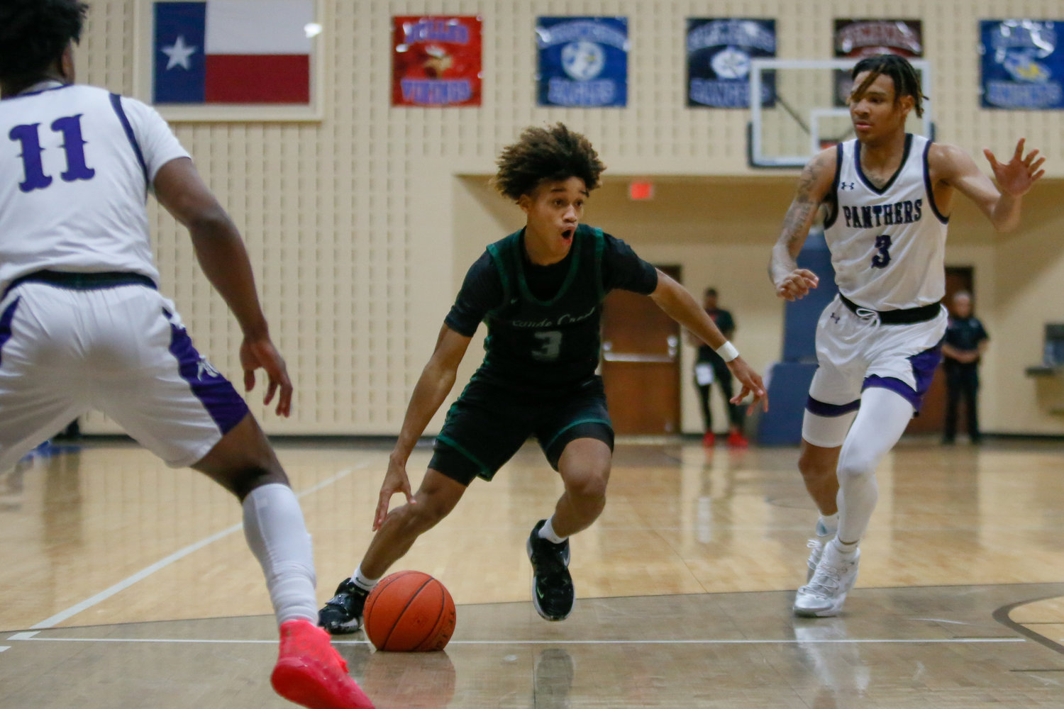 Christian Jones drives to the basket during Tuesday's game against Ridge Point.