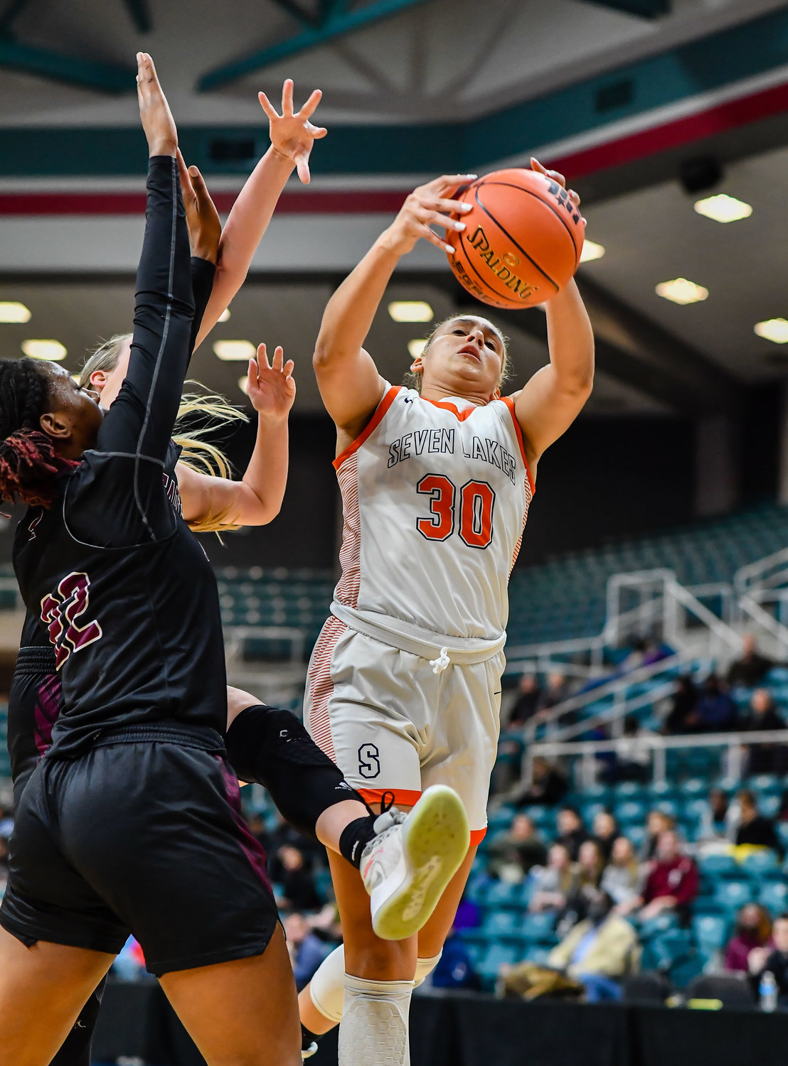 Katy Tx. Feb 25, 2022:  Seven Lakes Justice Carlton #30 pulls down the rebound during the Regional SemiFinal playoff game, Seven Lakes vs Pearland at the Merrell Center. (Photo by Mark Goodman / Katy Times)
