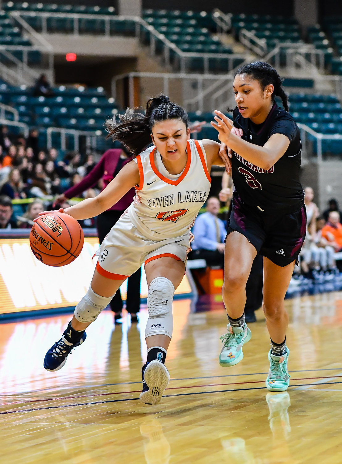 Katy Tx. Feb 25, 2022:  Seven Lakes Cailyn Tucker #12 drives to the basket during the Regional SemiFinal playoff game, Seven Lakes vs Pearland at the Merrell Center. (Photo by Mark Goodman / Katy Times)