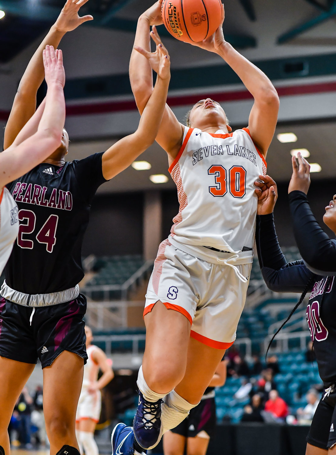 Katy Tx. Feb 25, 2022: Seven Lakes Justice Carlton #30 pulls down the rebound during the Regional SemiFinal playoff game, Seven Lakes vs Pearland at the Merrell Center. (Photo by Mark Goodman / Katy Times)
