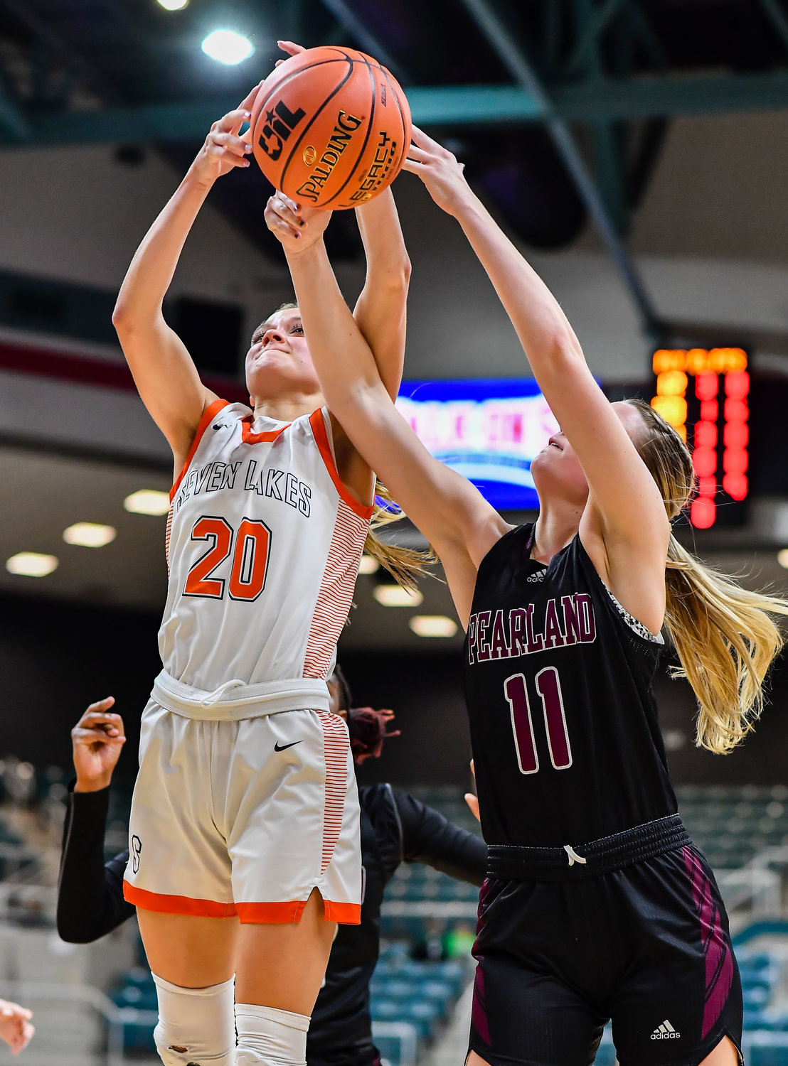 Katy Tx. Feb 25, 2022:  Seven Lakes Summer Halphen #20 and Pearlands Ashlynn Patrick #11 battle for the rebound during the Regional SemiFinal playoff game, Seven Lakes vs Pearland at the Merrell Center. (Photo by Mark Goodman / Katy Times)
