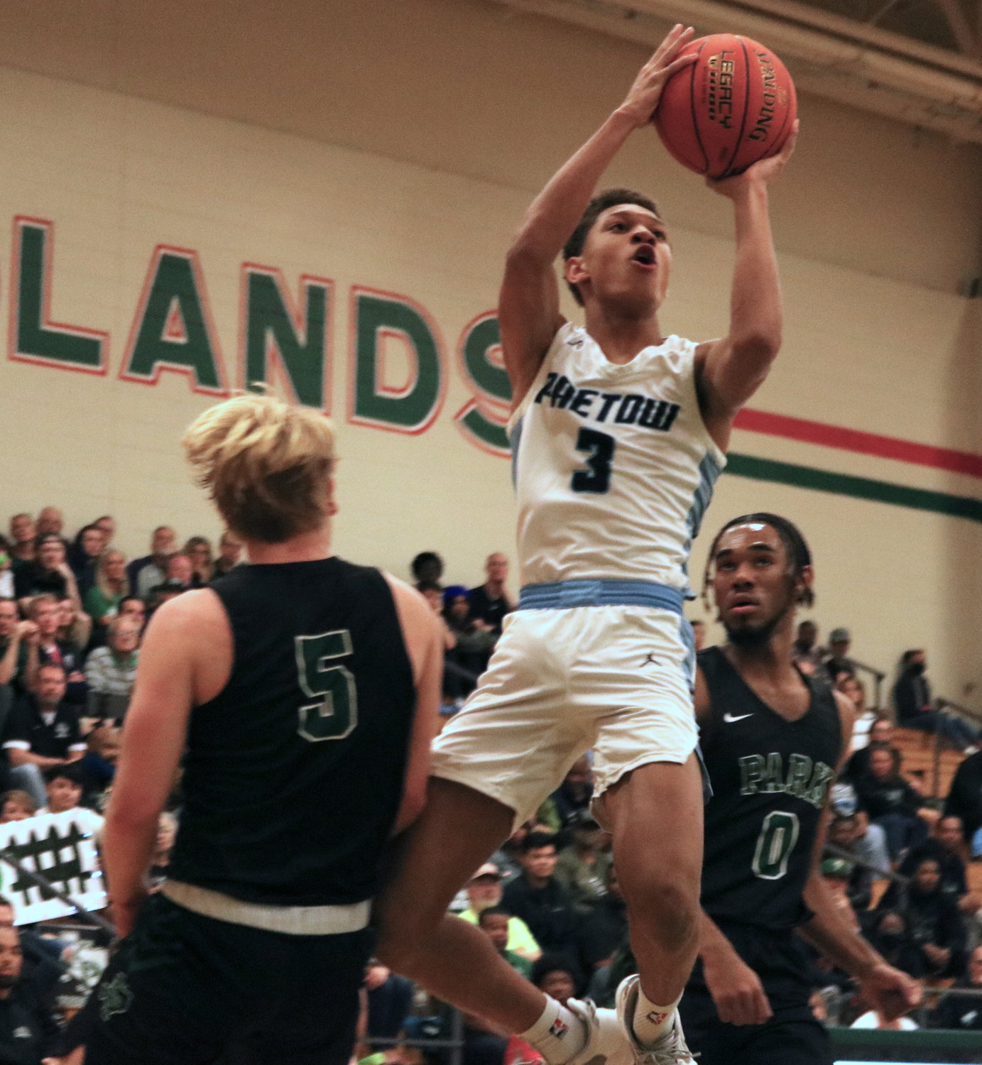 Kam Ingram shoots a floater during Monday’s game between Paetow and Kingwood Park at The Woodlands High School.