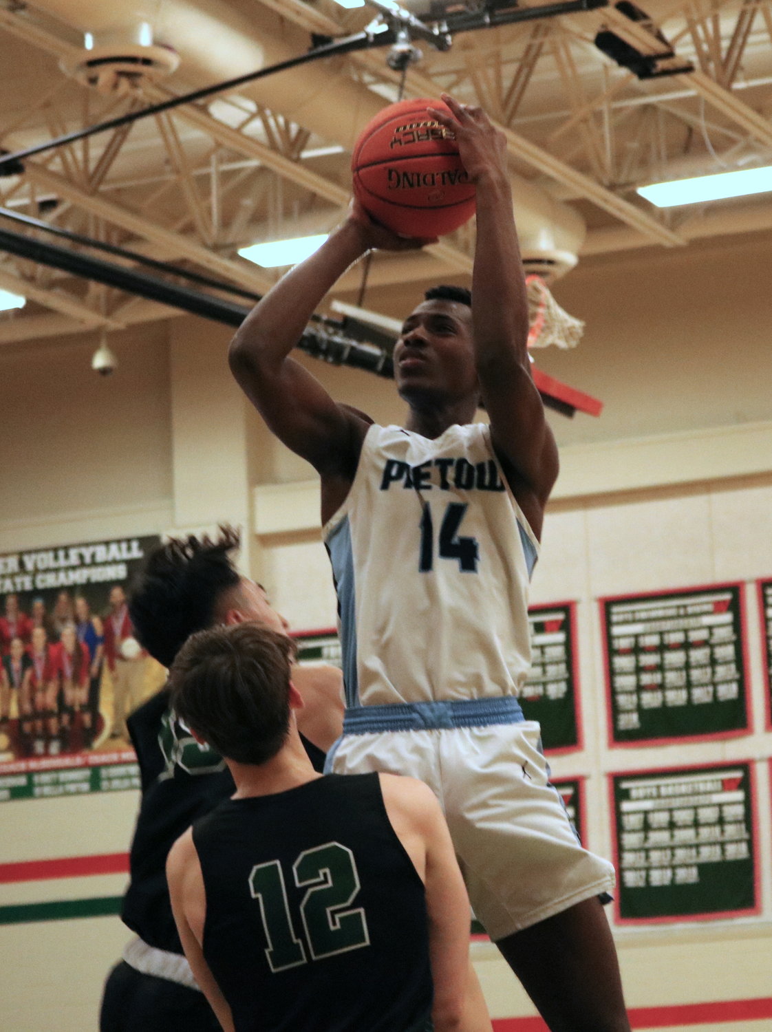 Abou Camara shoots a turnaround jumper during Monday’s game between Paetow and Kingwood Park at The Woodlands High School.