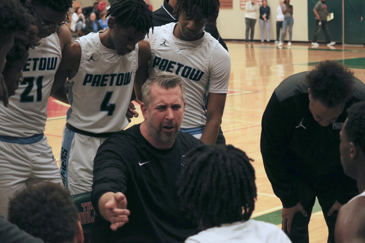 Mike Niemi talks to his team in a timeout during Monday’s game between Paetow and Kingwood Park at The Woodlands High School.