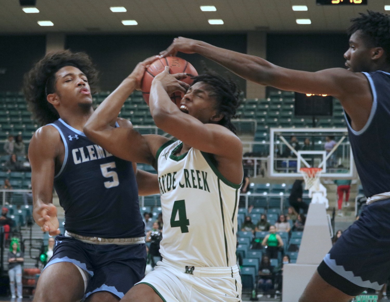 A defender tries to strip the ball from Angel Sonnier during Tuesday’s Class 6A regional quarterfinal between Mayde Creek and Fort Bend Clements at the Merrell Center.