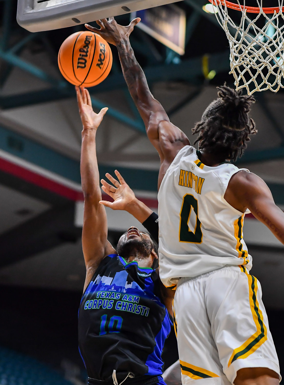 March 12,, 2022:  Southeastern Louisianas Jalyn Hinton #0 gets the block on a shot by A&M-Corpus Christis Isaac Mushila #10 during the Southland Conference Basketball Championship game between A&M Corpus Christi vs Southeastern Louisiana. (Photo by Mark Goodman / Katy Times)