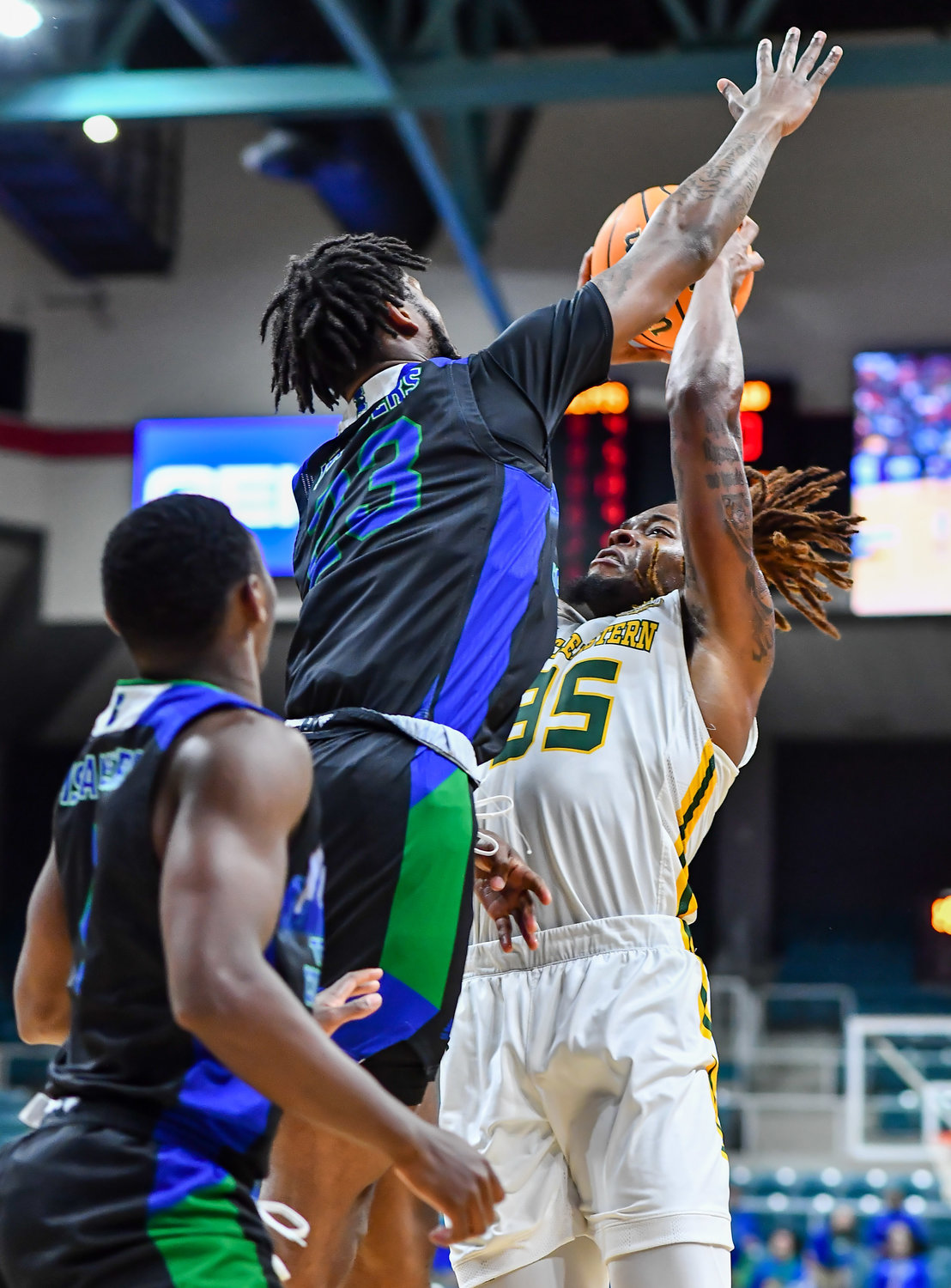 March 12,, 2022:   Southeastern Louisianas Gus Okafor #35 goes up for the shot guarded by A&M-Corpus Christis San Antonio Brinson #23 during the Southland Conference Basketball Championship game between A&M Corpus Christi vs Southeastern Louisiana. (Photo by Mark Goodman / Katy Times)