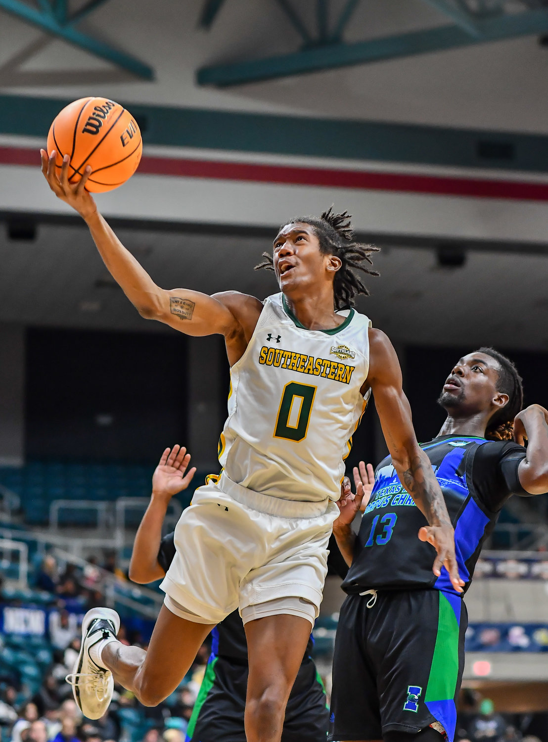 March 12,, 2022:  Southeastern Louisianas Jalyn Hinton #0 drives up to the basket during the Southland Conference Basketball Championship game between A&M Corpus Christi vs Southeastern Louisiana. (Photo by Mark Goodman / Katy Times)