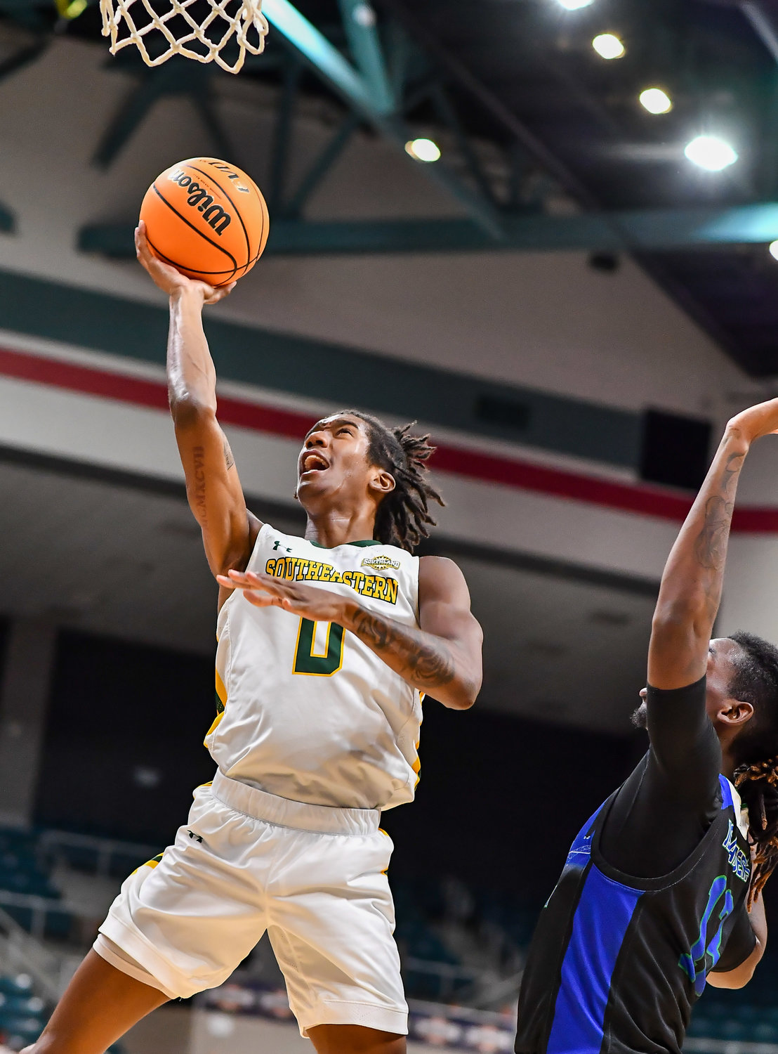 March 12,, 2022:  Southeastern Louisianas Jalyn Hinton #0 drives up to the basket during the Southland Conference Basketball Championship game between A&M Corpus Christi vs Southeastern Louisiana. (Photo by Mark Goodman / Katy Times)