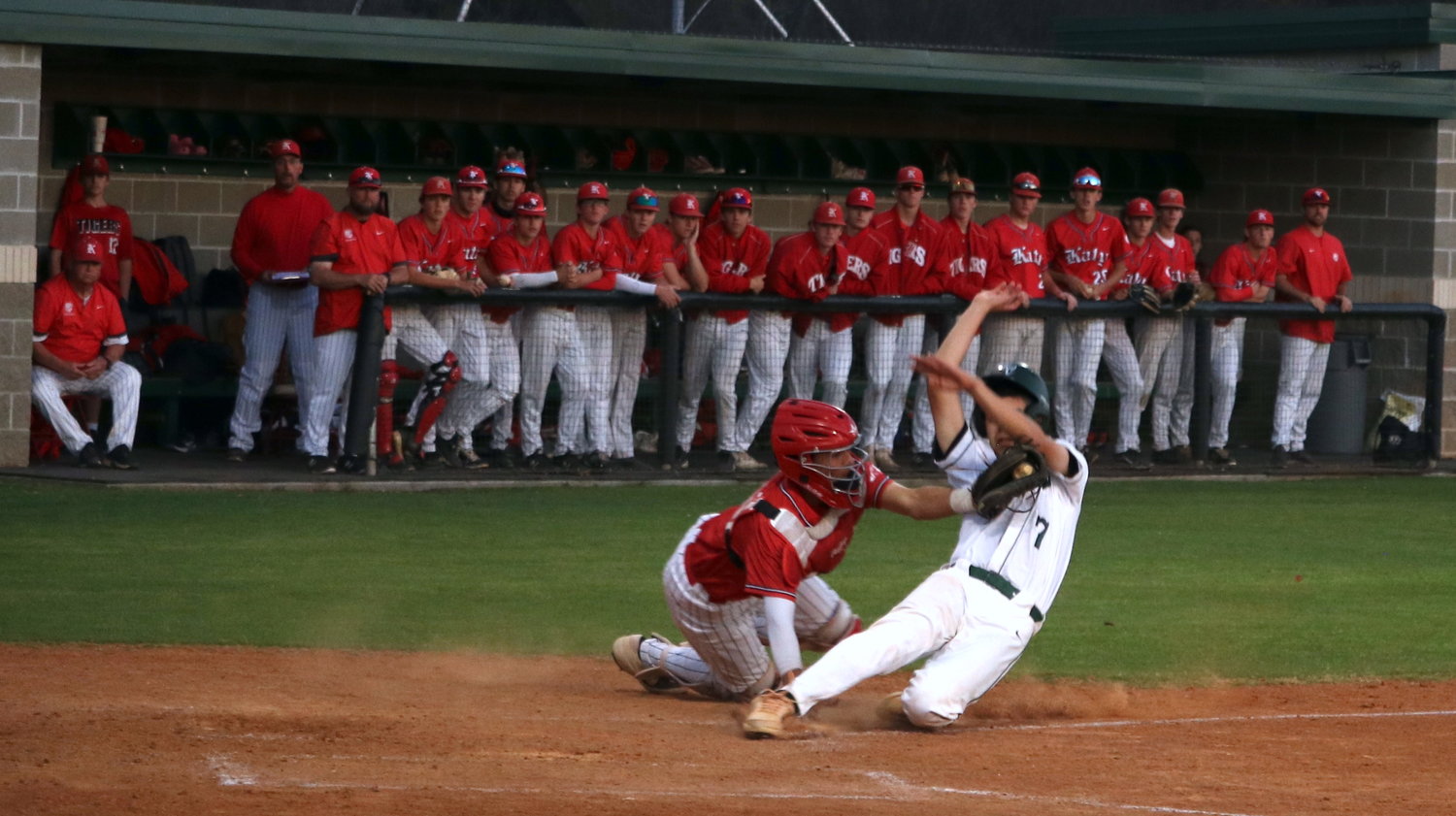 Reese Ruderman tags out a runner at home plate during Tuesday’s game between Katy and Mayde Creek at the Mayde Creek baseball field.