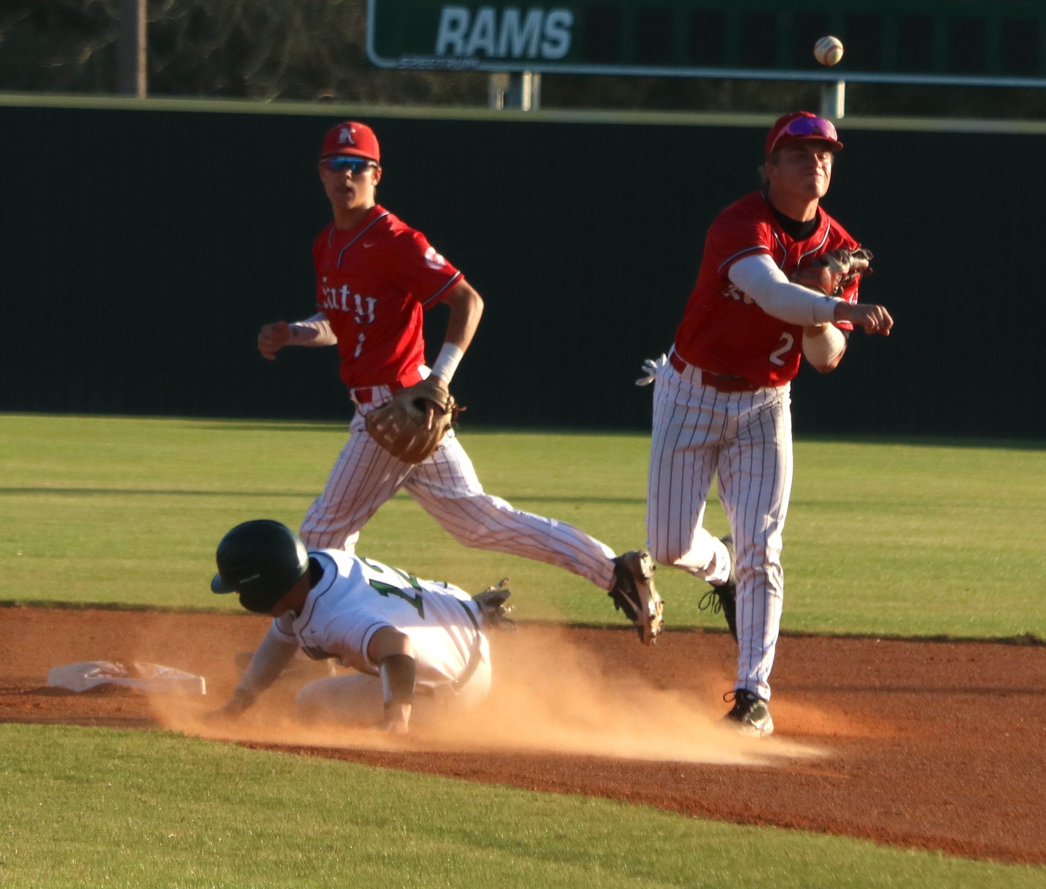 Parker Kidwell attempts to turn a double play during Tuesday’s game between Katy and Mayde Creek at the Mayde Creek baseball field.