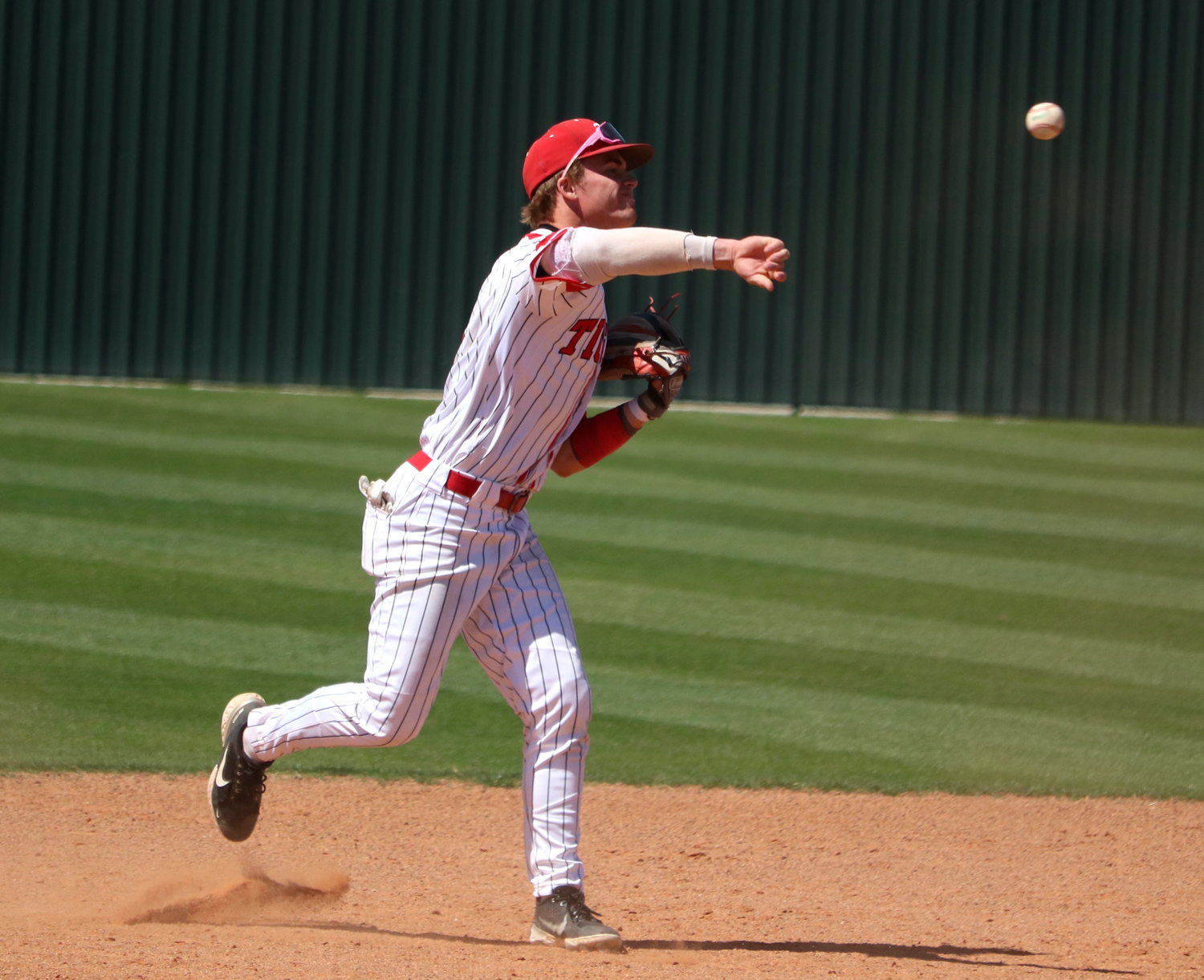 Parker Kidwell throws to first base during Friday’s game between Katy and Cinco Ranch at the Katy baseball field.