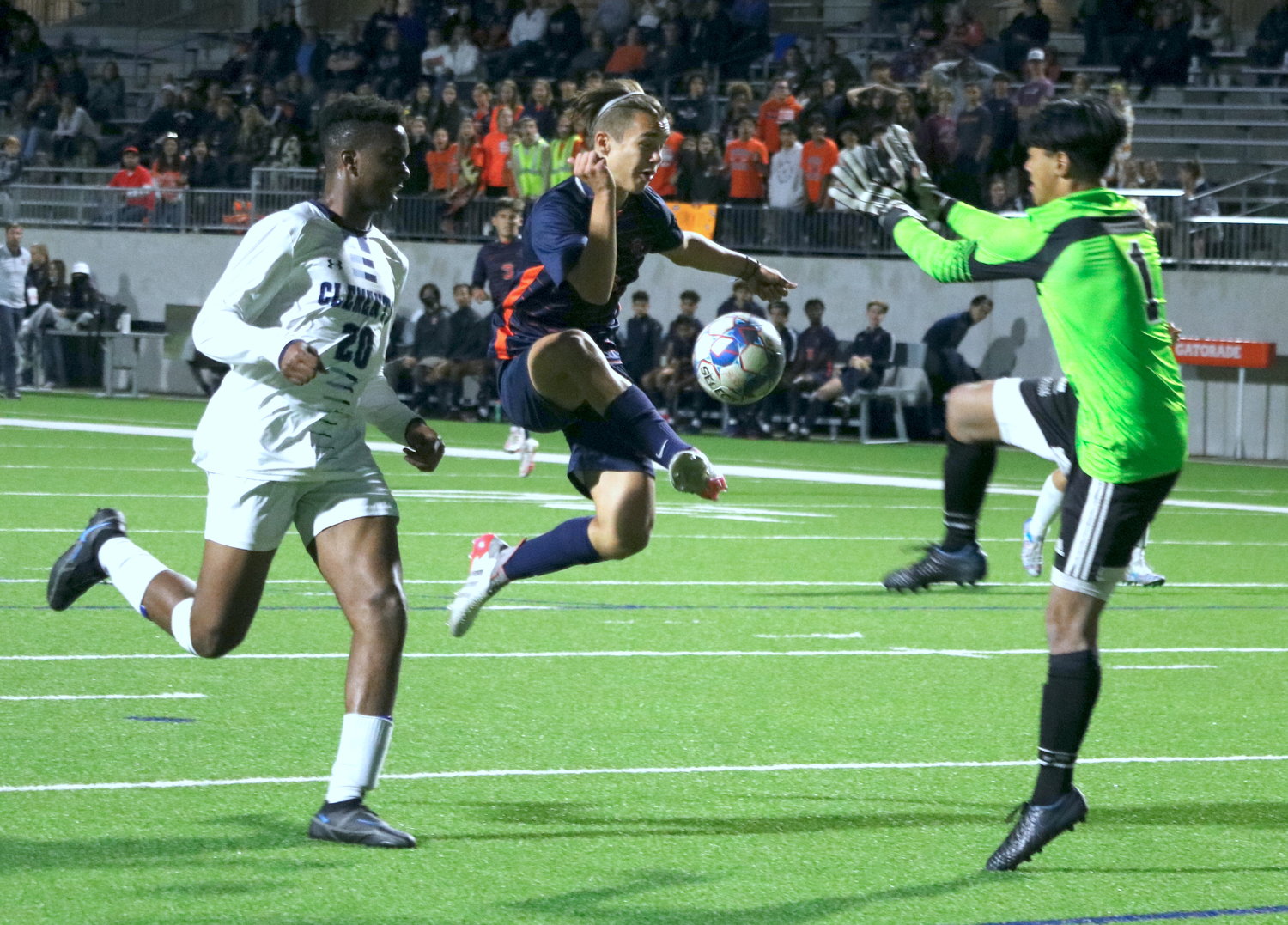 Kortay Koc jumps to try and volley a ball towards goal during Thursday’s Class 6A bi-district game between Seven Lakes and Fort Bend Clements at Legacy Stadium.