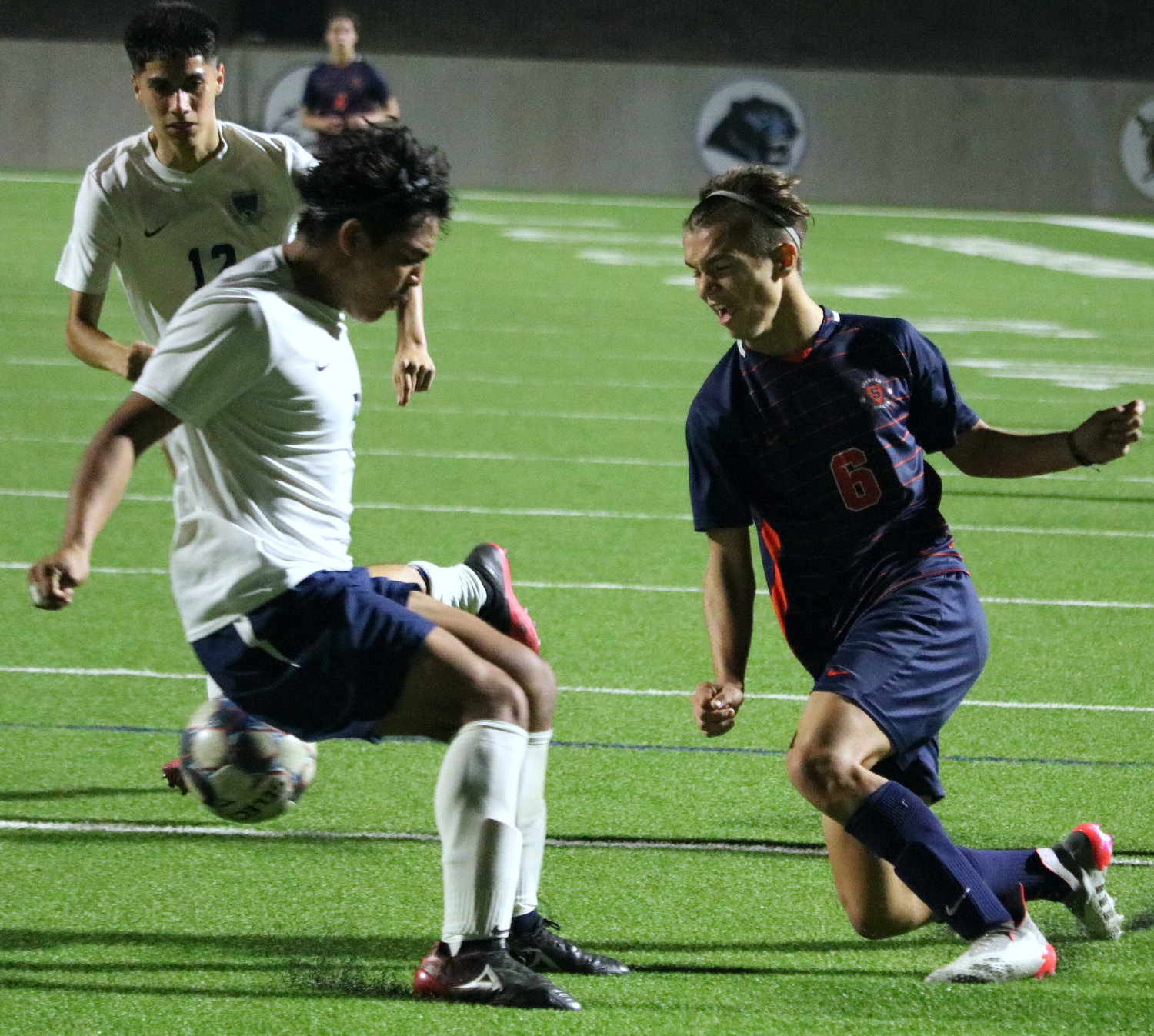 Kortay Koc centers a pass for Hunter Merritt during Tuesday’s Class 6A area round game between Seven Lakes and Cy-Ridge at Legacy Stadium.
