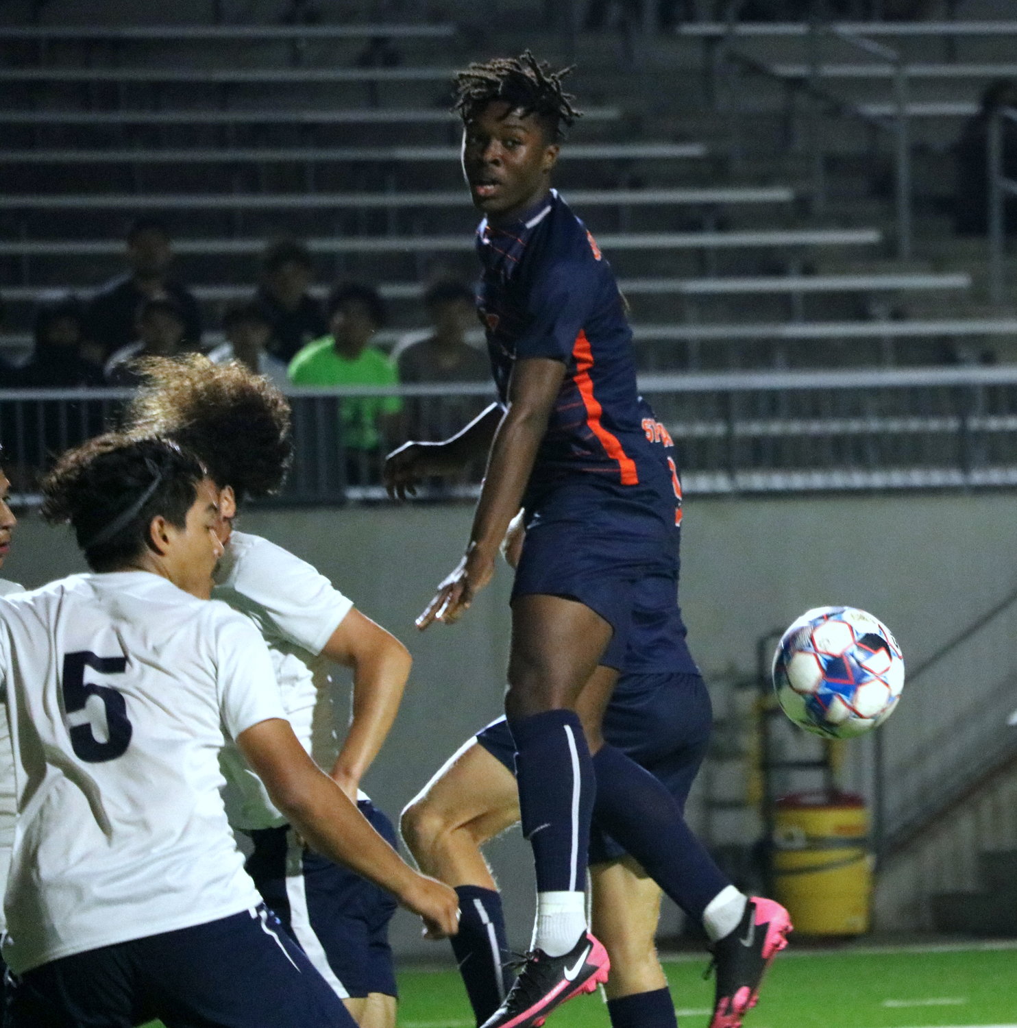 Daniel Ejerenwa heads a ball towards a teammate during Tuesday’s Class 6A area round game between Seven Lakes and Cy-Ridge at Legacy Stadium.