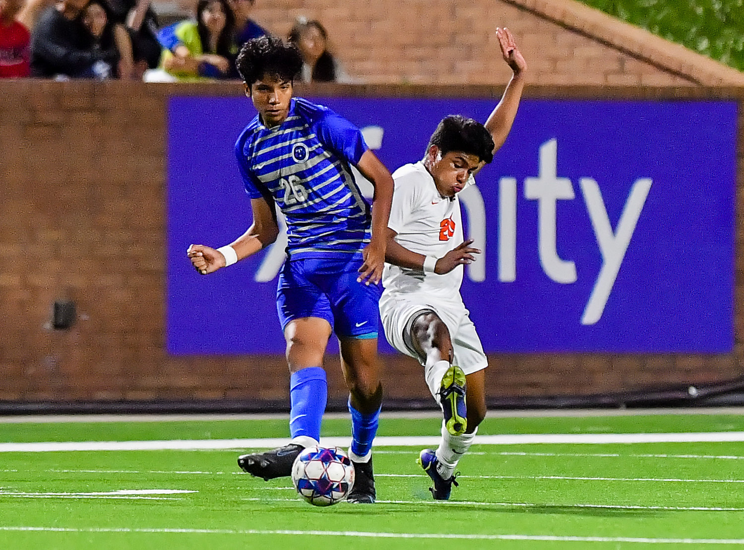 April 1, 2022: Katy Taylors Erick Arellano #26 and Seven Lakes Alexis Matute #20 go for the ball during Regional Quarterfinal soccer playoff, Seven Lakes vs Katy Taylor at Rhode Stadium. (Photo by Mark Goodman / Katy Times)