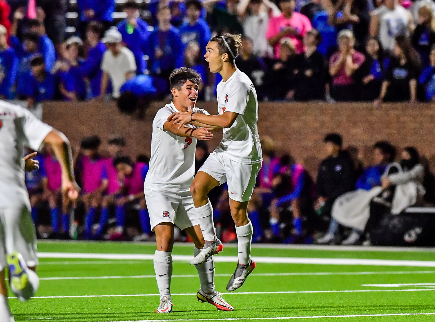 April 1, 2022: Seven Lakes Kortay Koc #6 and Seven Lakes Ty Koc #3 celebrate the score by Koc during Regional Quarterfinal soccer playoff, Seven Lakes vs Katy Taylor at Rhode Stadium. On the block attempt is Katy Taylors Erick Arellano #26 (Photo by Mark Goodman / Katy Times)