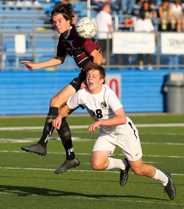 Jordan defender Pierce Sanchez (28) defends against Dripping Springs forward Lukas Buchberger (7) during the Class 5A boys state semifinal between Dripping Springs and Katy Jordan on April 14, 2022 in Georgetown, Texas.